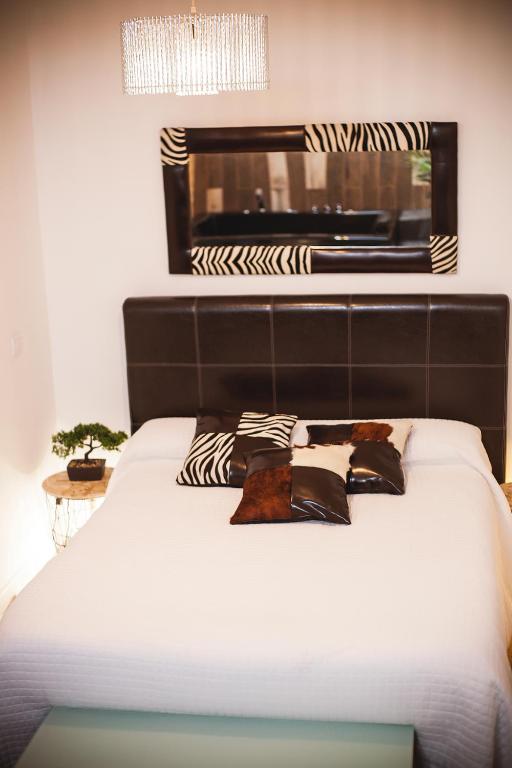 Posteľ alebo postele v izbe v ubytovaní Junior Suites con Jacuzzi