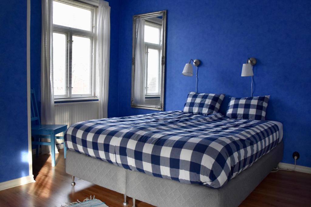 Postel nebo postele na pokoji v ubytování Mooi! Gula Huset