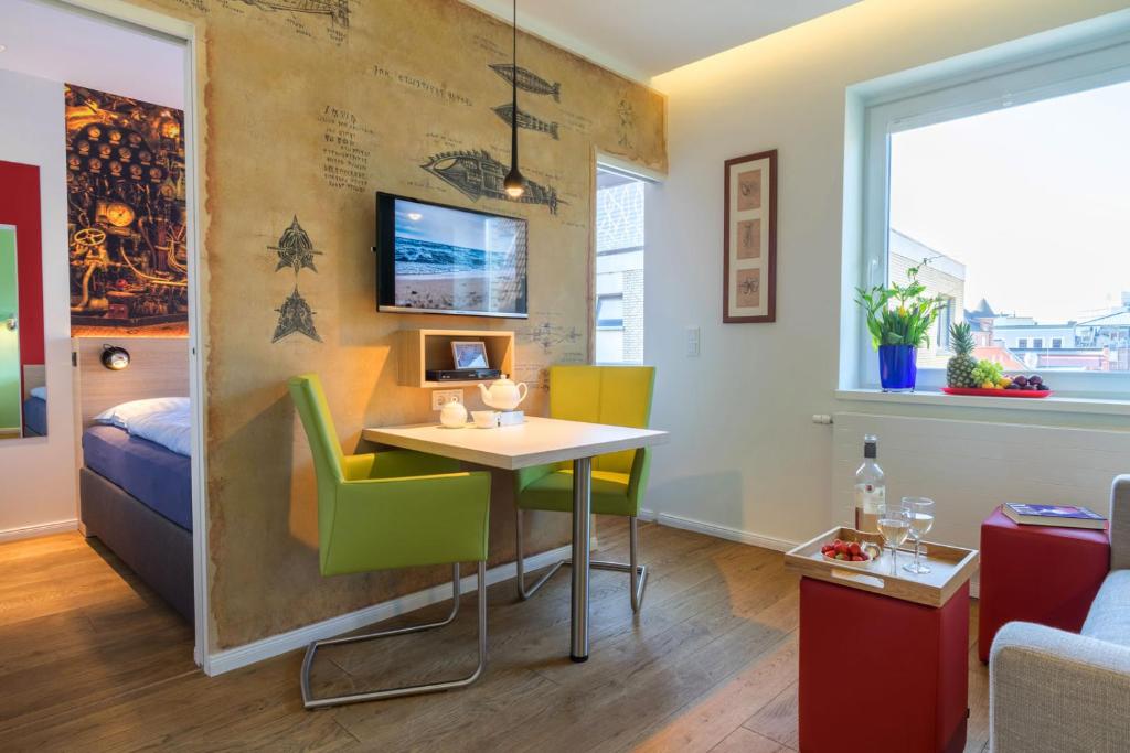 TV a/nebo společenská místnost v ubytování neyland apartments Norderney