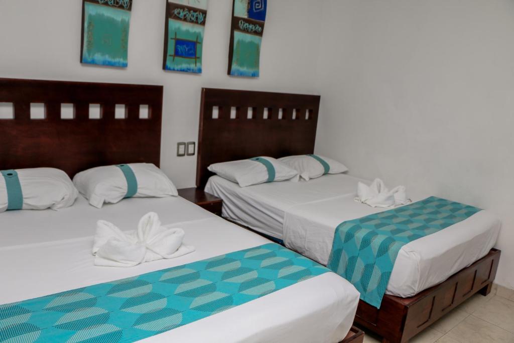 Postel nebo postele na pokoji v ubytování Playa Linda Hotel