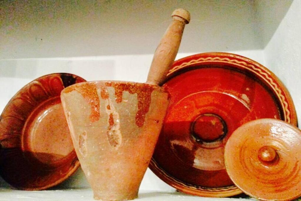 a close up of a red object with a spoon in it at Casa De Enguídanos in Enguídanos