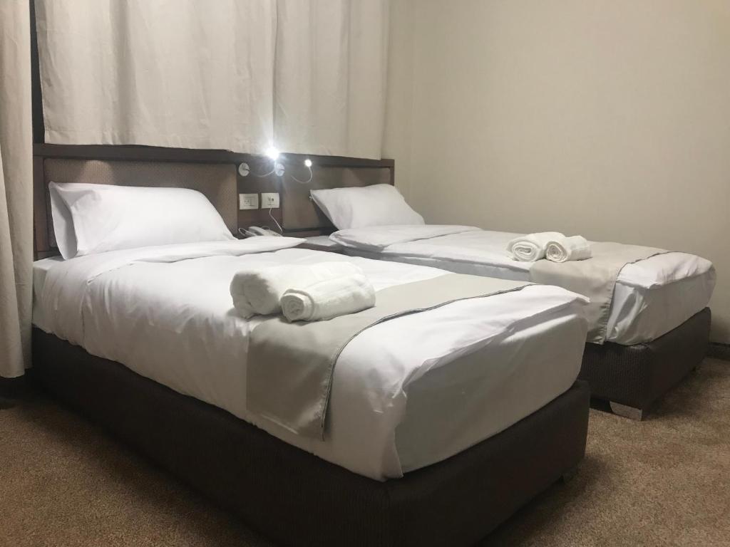 Postel nebo postele na pokoji v ubytování Eli Guest House