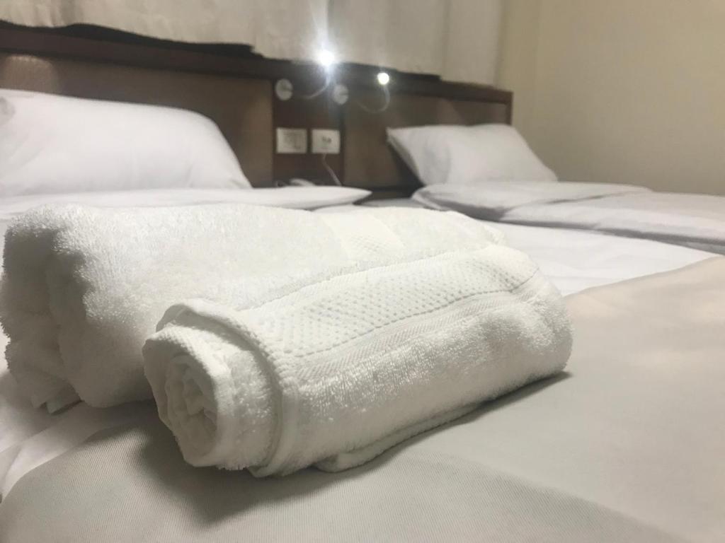 Postel nebo postele na pokoji v ubytování Eli Guest House