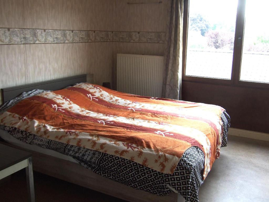 Ένα ή περισσότερα κρεβάτια σε δωμάτιο στο GUESTROOMS BIJ HET STATION VAN DRONGEN
