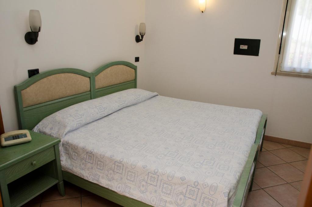 Postel nebo postele na pokoji v ubytování Albergo Cenni
