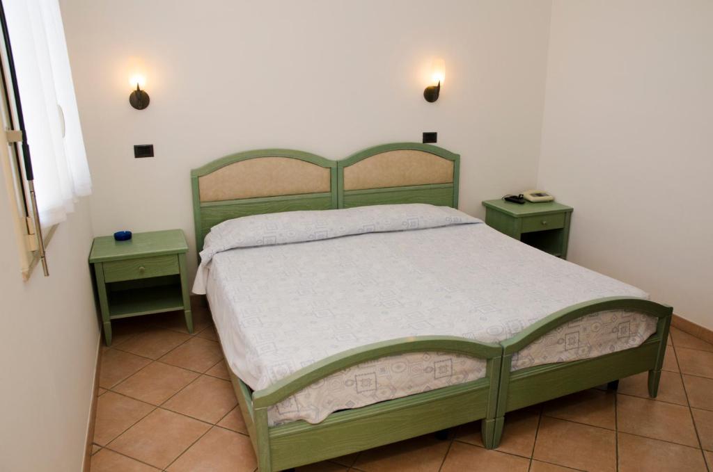 Postel nebo postele na pokoji v ubytování Albergo Cenni