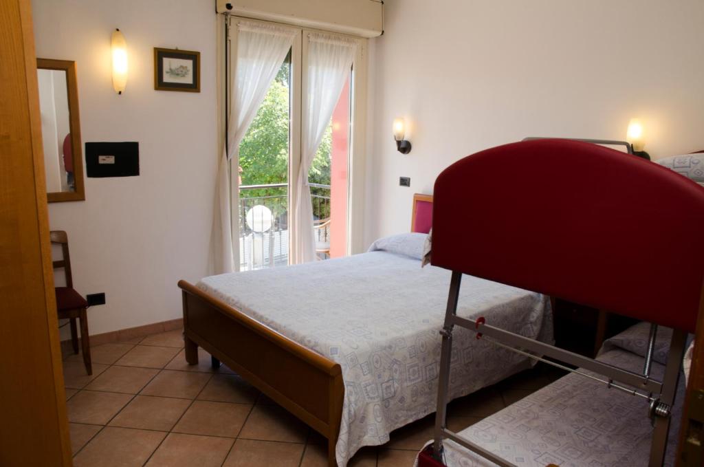Postel nebo postele na pokoji v ubytování Albergo Cenni