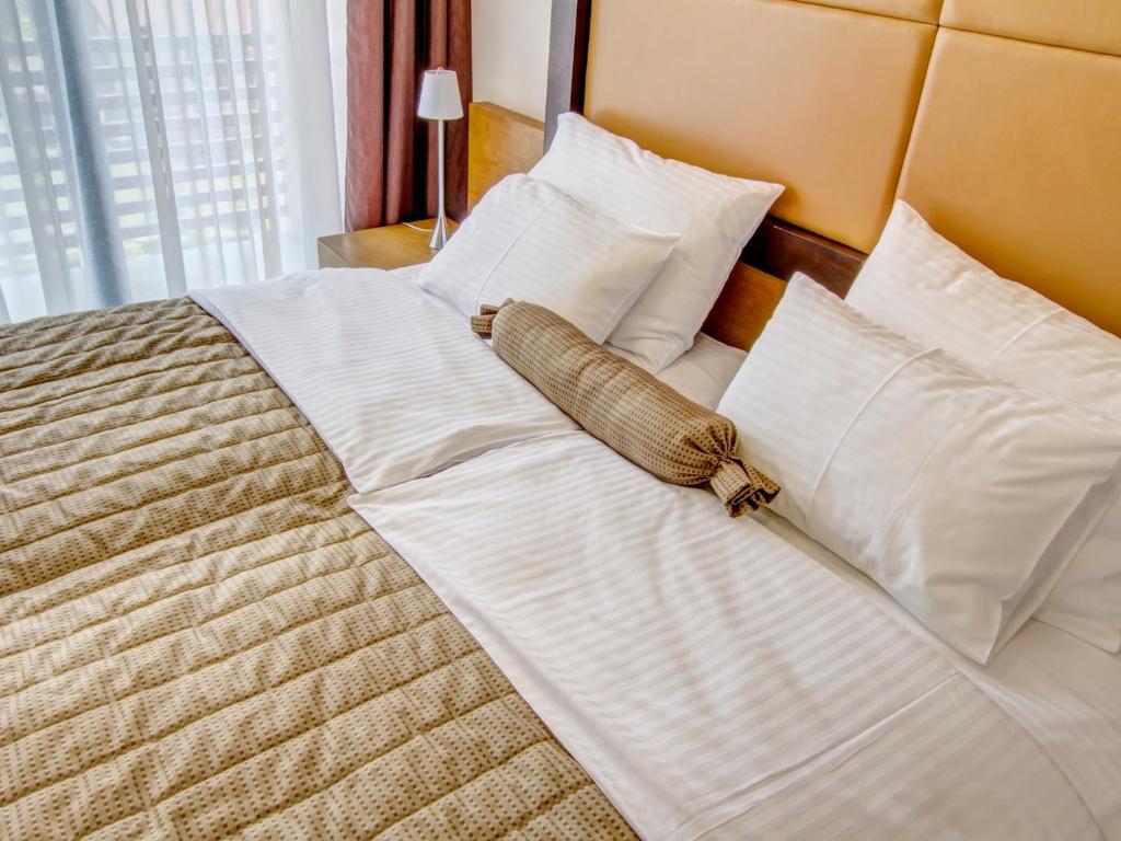 Postel nebo postele na pokoji v ubytování Hotel MIR