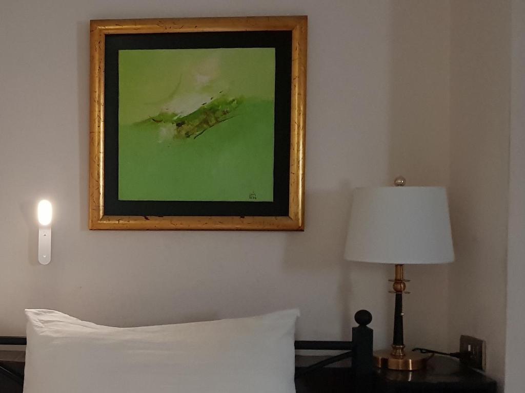 Postel nebo postele na pokoji v ubytování Memory Hotel