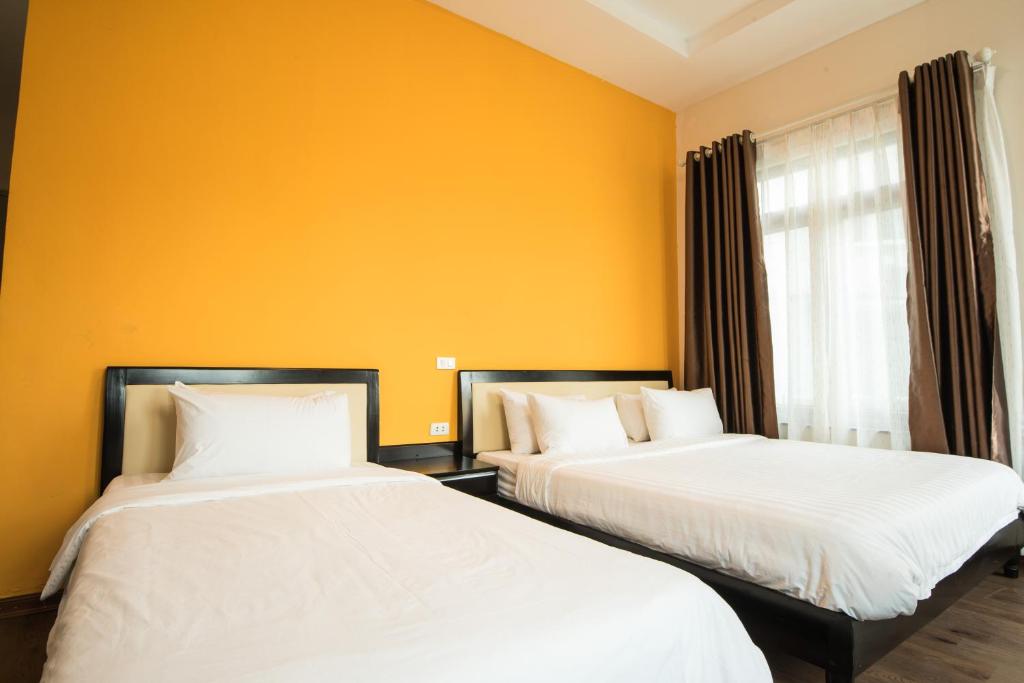 Postel nebo postele na pokoji v ubytování Hanoi Buffalo Hostel