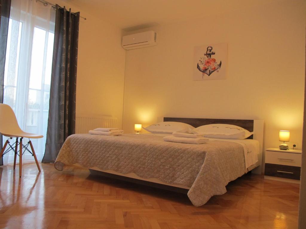 Postel nebo postele na pokoji v ubytování Perivoj