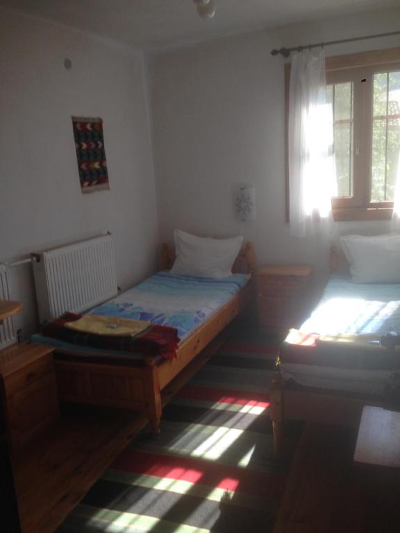 Postel nebo postele na pokoji v ubytování Borimechkova Kashta