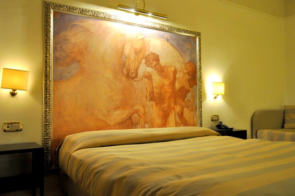 Postel nebo postele na pokoji v ubytování Albergo Sant'Emidio