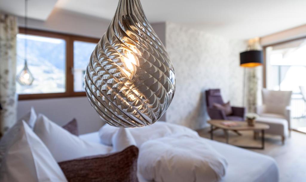 Postel nebo postele na pokoji v ubytování Hotel Sonnbichl