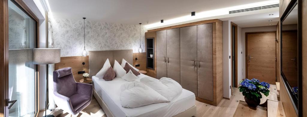 Postel nebo postele na pokoji v ubytování Hotel Sonnbichl