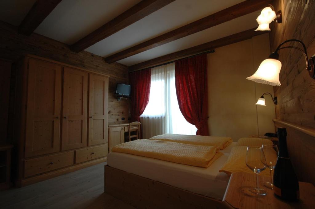Postel nebo postele na pokoji v ubytování Hotel La Tea