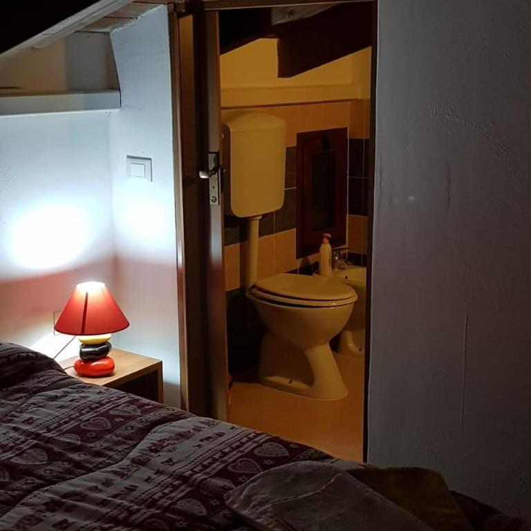 A bed or beds in a room at Affittacamere Luti