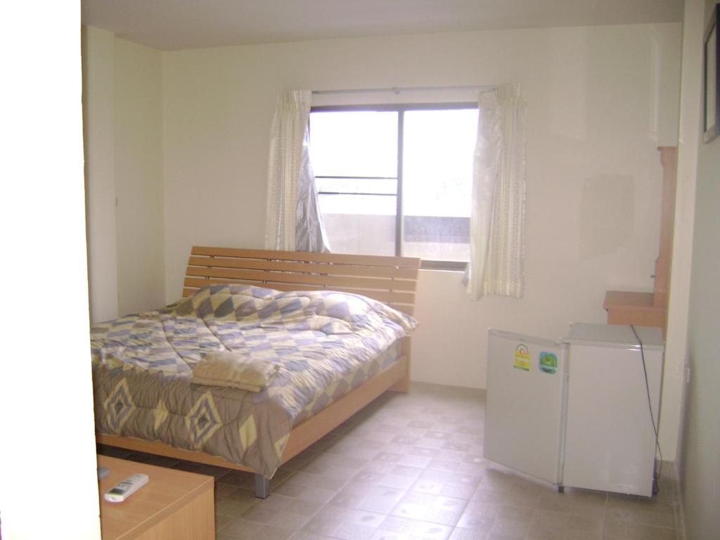 Postel nebo postele na pokoji v ubytování TK Guesthouse
