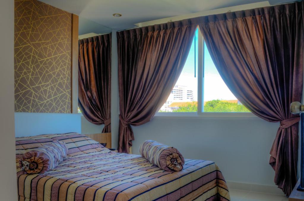 Postel nebo postele na pokoji v ubytování Amazon Residence Unit B1-217