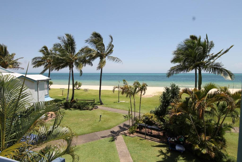 a view of the beach from the balcony of a resort at Moreton Island Villas and Apartments in Tangalooma