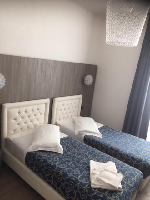 Postel nebo postele na pokoji v ubytování Hotel Centrale