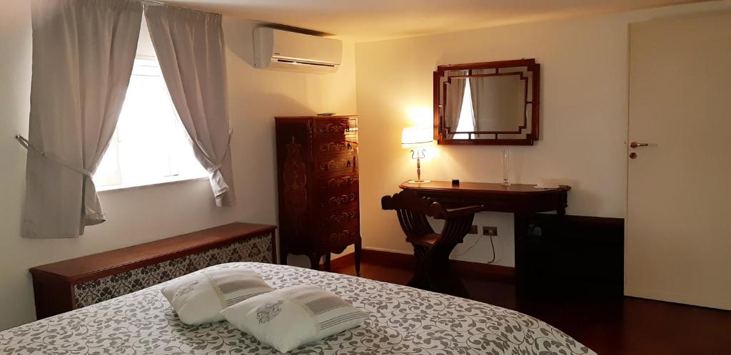 A bed or beds in a room at Casa de Spuches