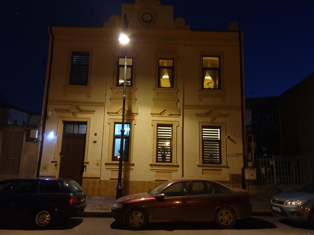 a building with a street light in front of it at Casa Kogalniceanu in Constanţa
