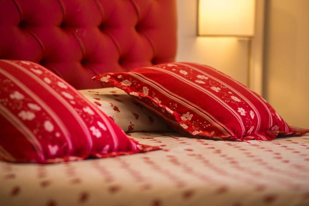 Postel nebo postele na pokoji v ubytování Hotel Le Mura