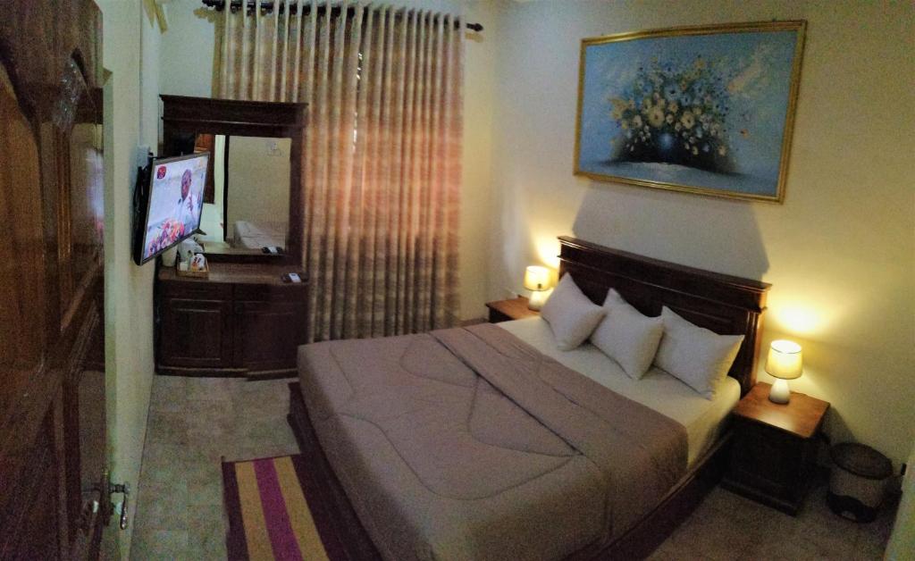Postel nebo postele na pokoji v ubytování holidays hotel