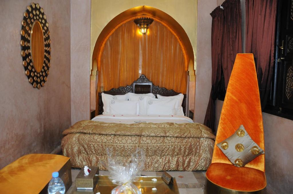 A bed or beds in a room at Riad Wow