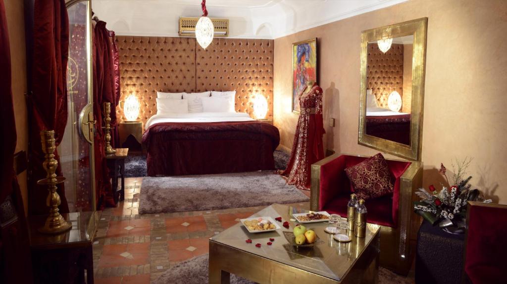 A bed or beds in a room at Riad Wow