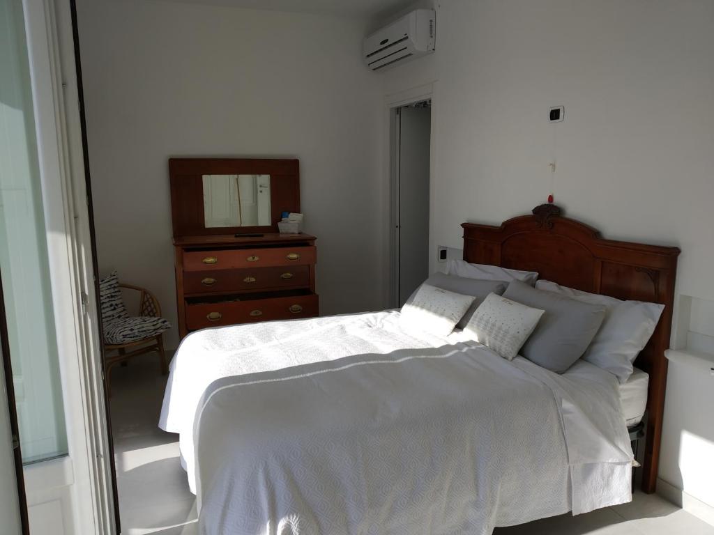 Postel nebo postele na pokoji v ubytování La Casa dei Panorami di Colobraro