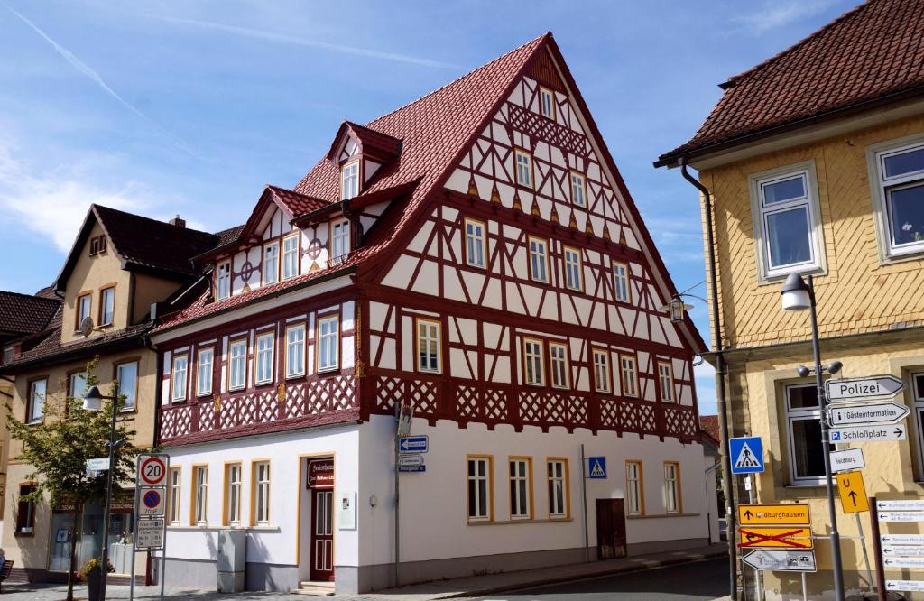 a half timbered building with a red roof at Ferienwohnung Veste Coburg in Bad Rodach