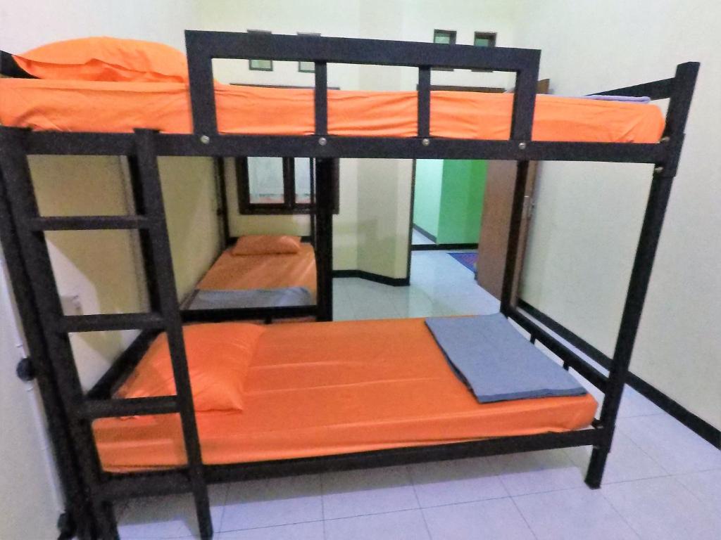 Postel nebo postele na pokoji v ubytování Dhika Adventure