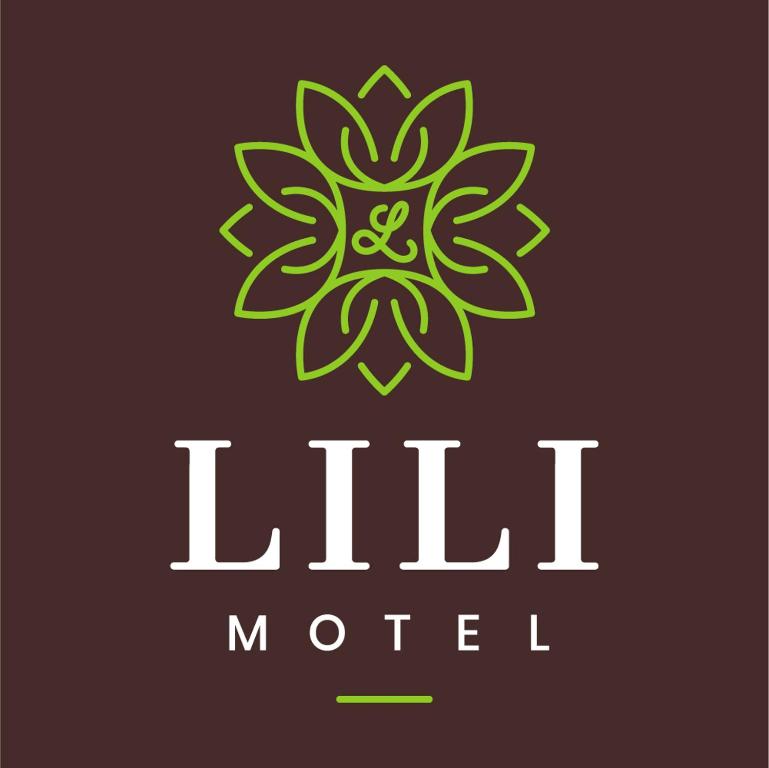 a green and white logo for a hotel at Lili Motel in Sajószentpéter
