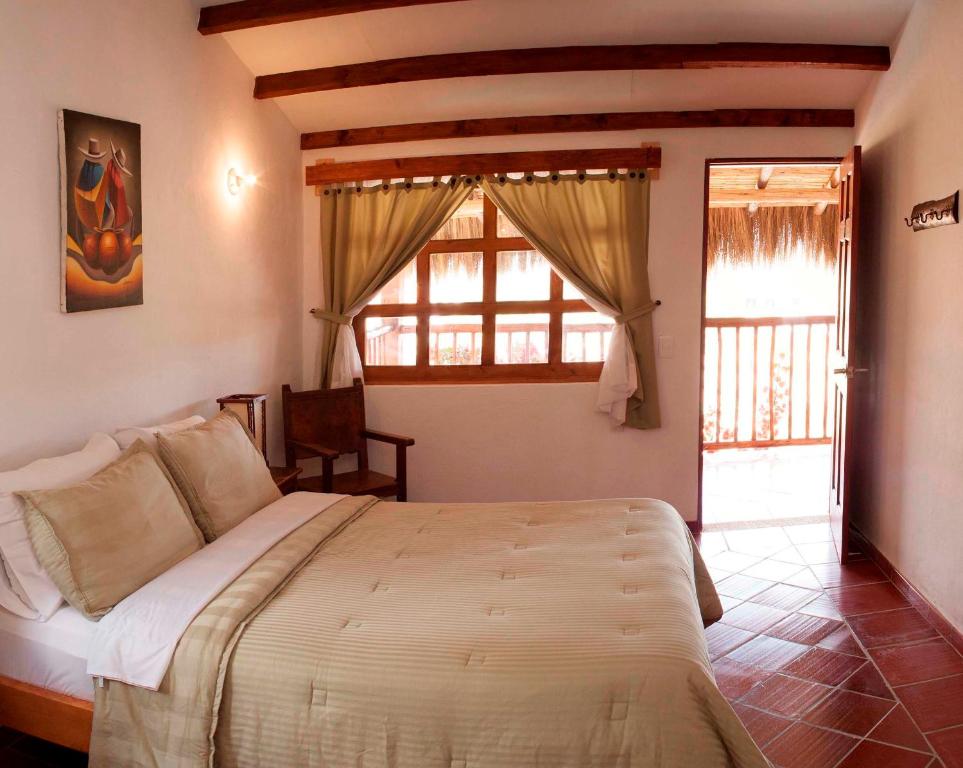 Кровать или кровати в номере HOTEL CAMPESTRE LA CASONA VILLA de LEYVA