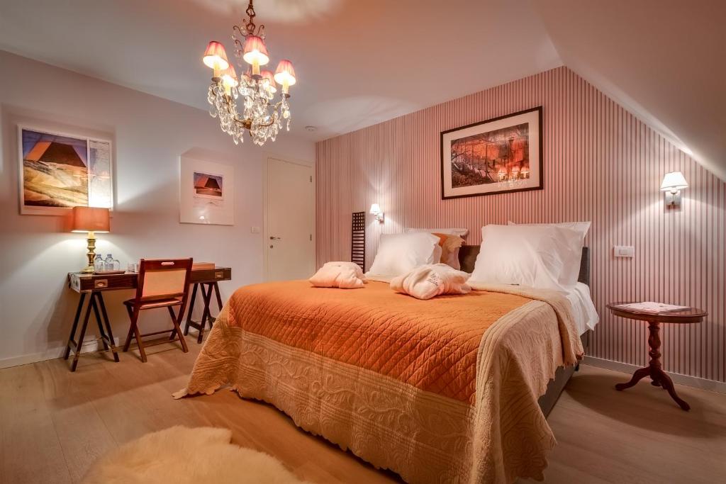 Postel nebo postele na pokoji v ubytování B&B Maison seki