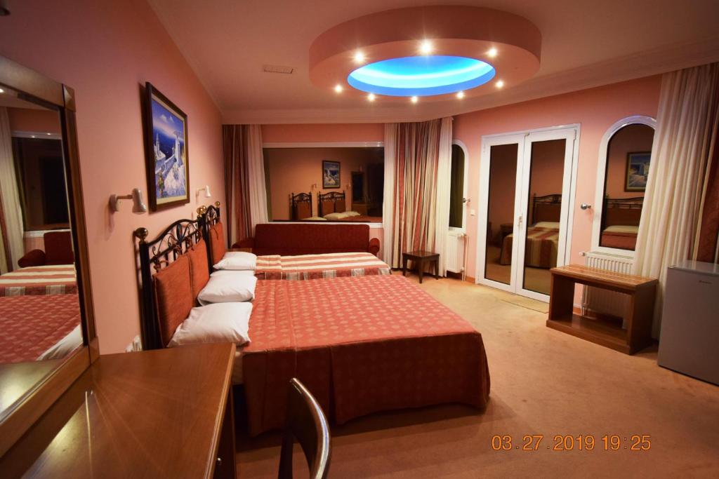 Postel nebo postele na pokoji v ubytování Hotel Aperio