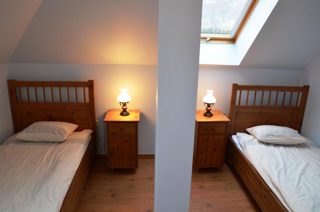 Posteľ alebo postele v izbe v ubytovaní Apartamenty Dom na Wzgórzu Gardenia
