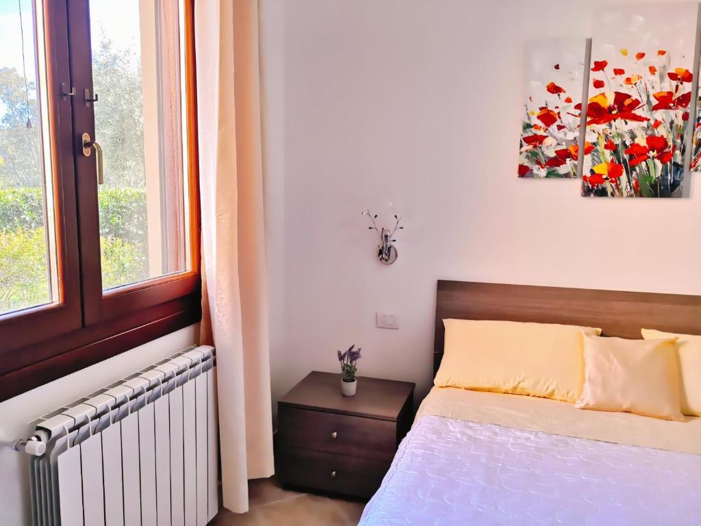 Postel nebo postele na pokoji v ubytování A Lu Ponti