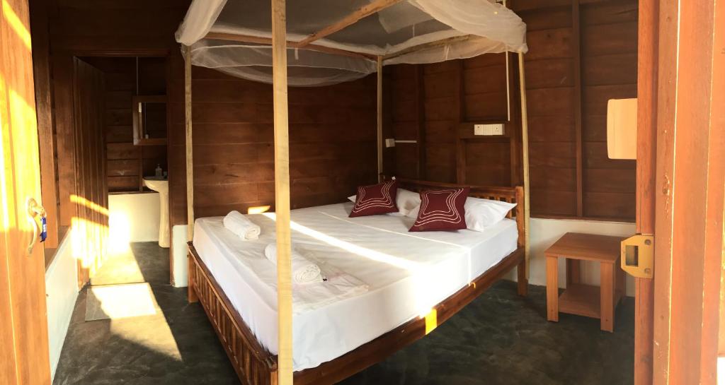 Postel nebo postele na pokoji v ubytování De Perla Resort