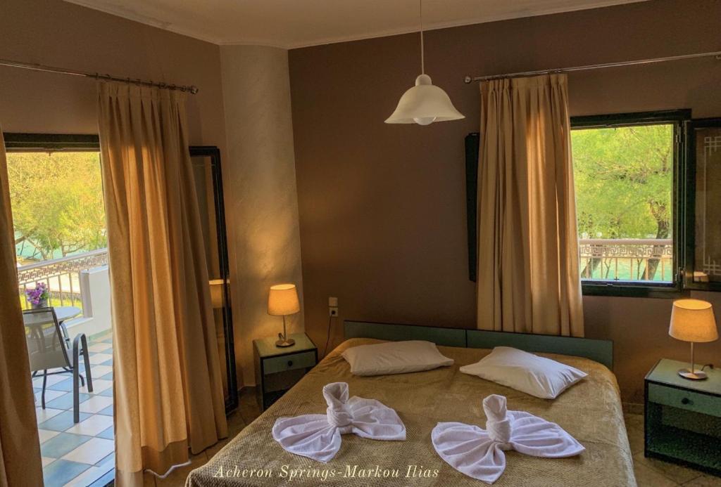 A bed or beds in a room at Acheron Springs-Markou Ilias