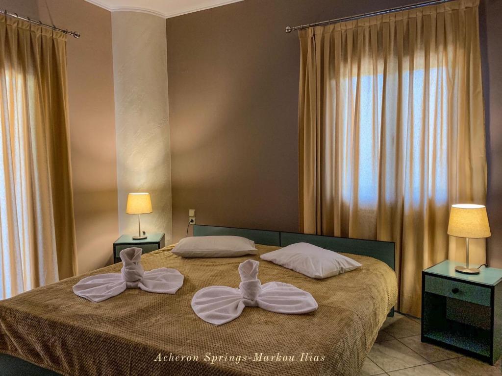 A bed or beds in a room at Acheron Springs-Markou Ilias