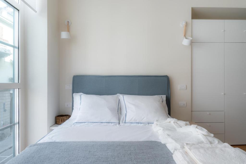 A bed or beds in a room at Mini loft Moscova