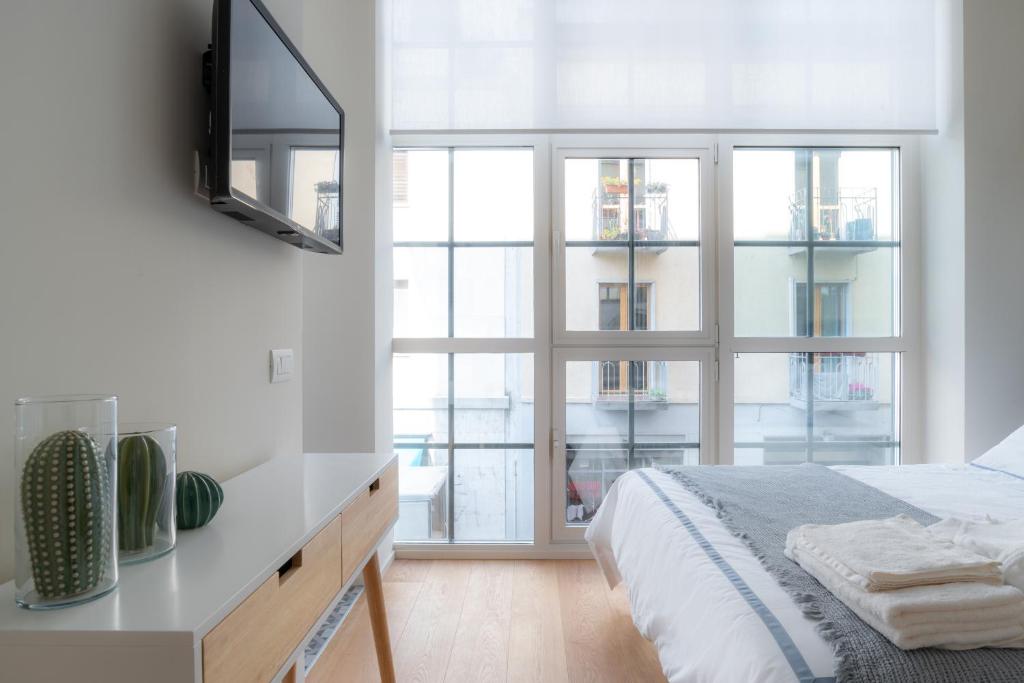 A bed or beds in a room at Mini loft Moscova