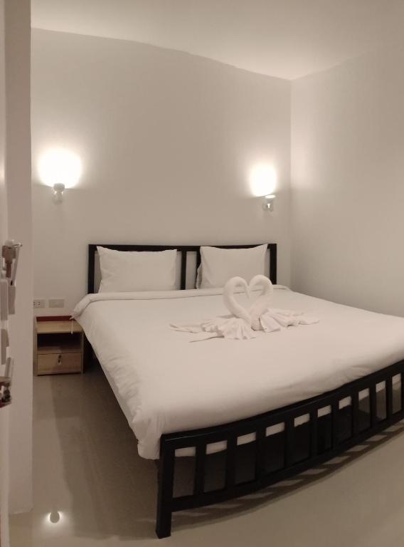 Voodi või voodid majutusasutuse Chaweng best hotel and hostel samui toas