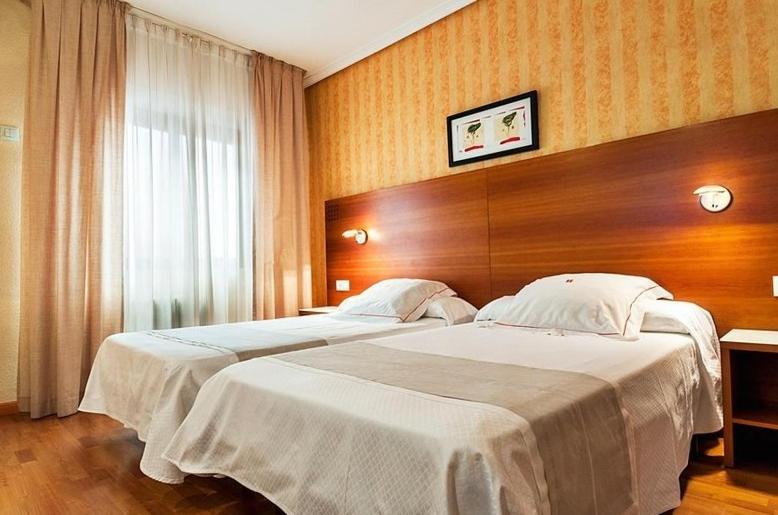Postel nebo postele na pokoji v ubytování Hotel Xauen