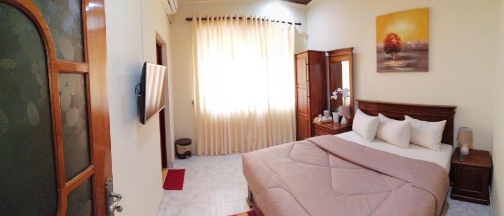 Postel nebo postele na pokoji v ubytování holidays hotel