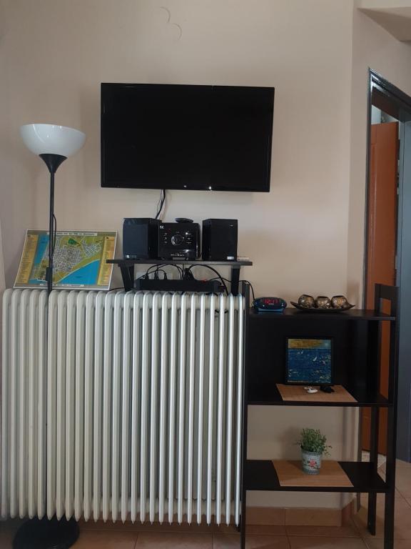 TV a/nebo společenská místnost v ubytování Cozy Loft