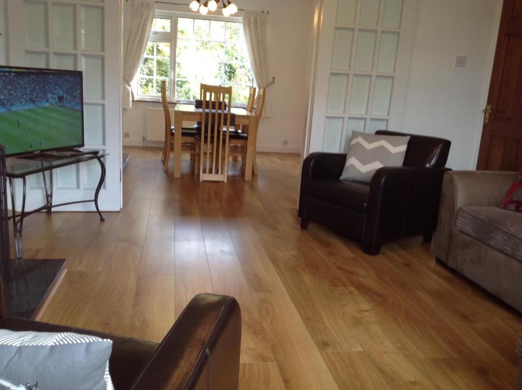 a living room with a couch and chairs and a table at 13 Pearse Tce. in Sligo